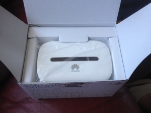 The Huawei Mobile WiFi E5330 sitting at the top of the box once opened